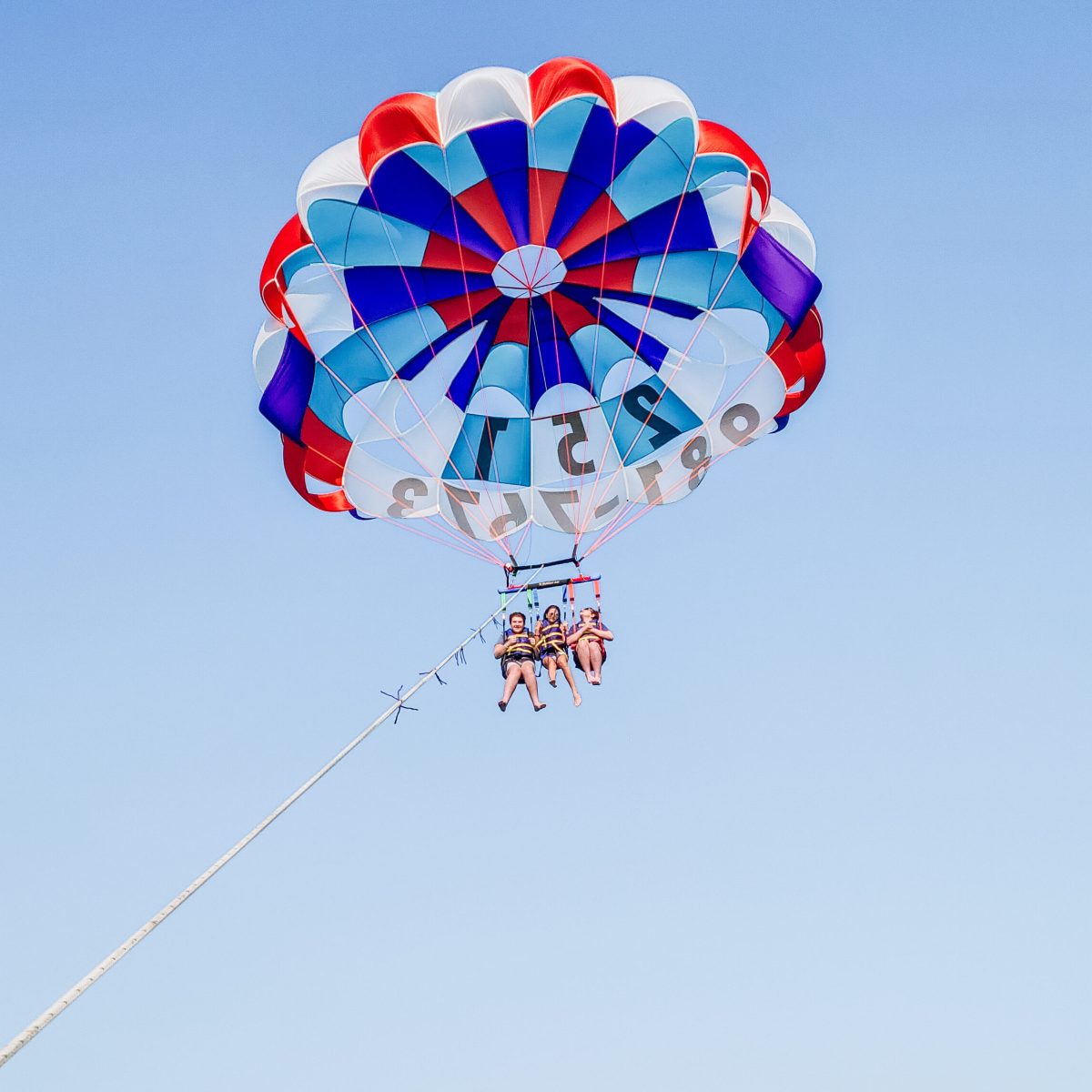 20220326_152852 three people parasailing