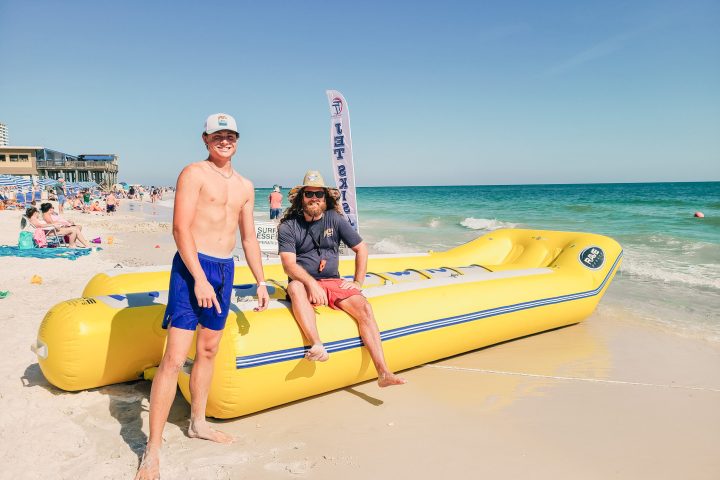 two people posing with a banana boat