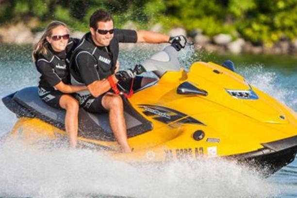 two people riding on a jet ski