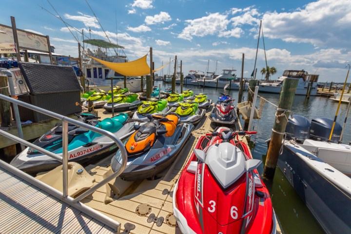 several jet skis docked at a marina