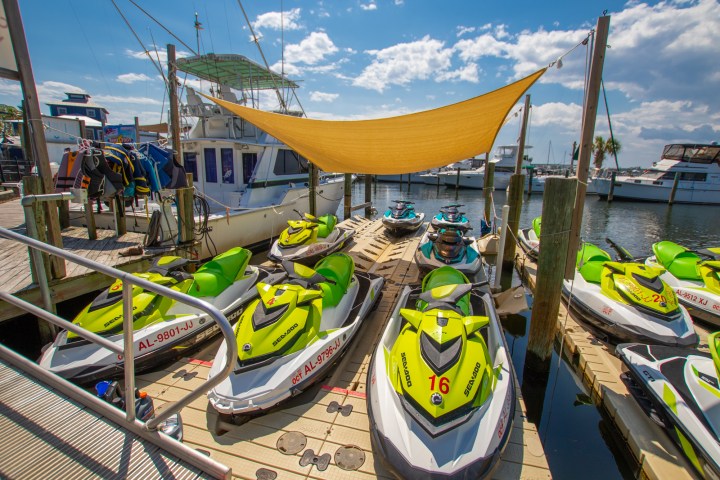 several jet skis docked at a marina