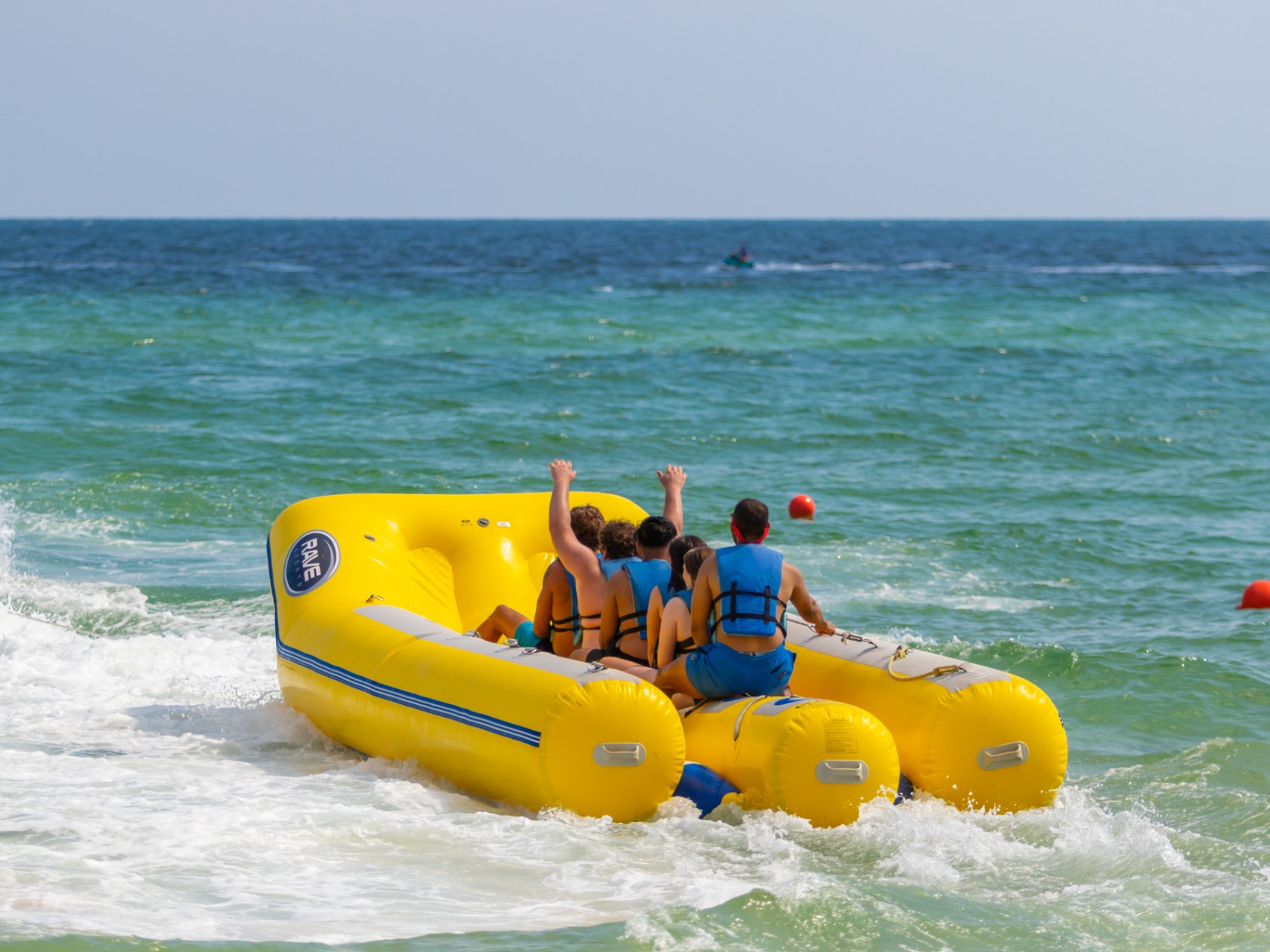 a group of people riding on a banana boat