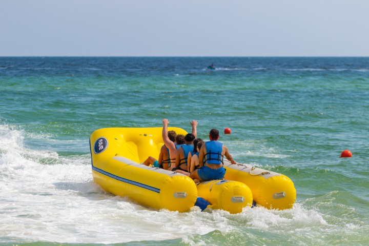 a group of people riding on a banana boat