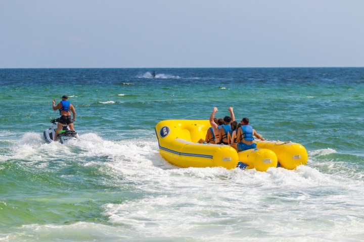 a group of people riding on a banana boat